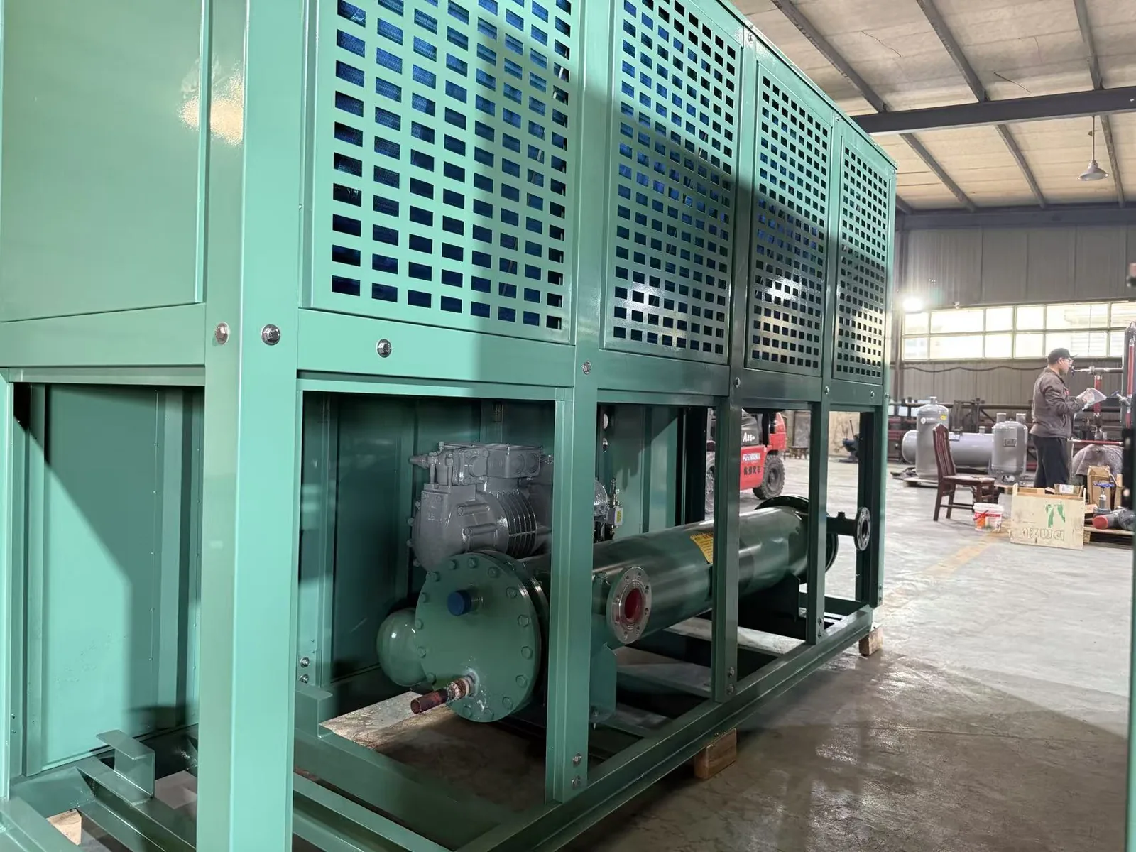 Green refrigeration unit frame in a factory